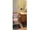 Bathroom featuring a standard toilet, vanity with sink, and neutral color scheme at 1923 Manhattan Pkwy, Decatur, GA 30035