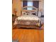 Comfortable bedroom featuring a decorative headboard and matching nightstands at 1923 Manhattan Pkwy, Decatur, GA 30035