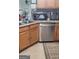 Kitchen featuring wood cabinetry, stainless steel appliances, and granite countertops at 1923 Manhattan Pkwy, Decatur, GA 30035
