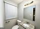 Bathroom featuring a granite vanity, with contemporary fixtures and a well-lit mirror at 3376 Brookfield Ln, Decatur, GA 30032