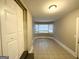 Empty room featuring tile floors, neutral paint, and a large bay window with great natural light at 3376 Brookfield Ln, Decatur, GA 30032