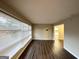 Bright living room featuring wood floors, neutral paint, and large windows with great natural light at 3376 Brookfield Ln, Decatur, GA 30032