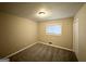 Comfortable bedroom with neutral carpet and a large window, ideal for relaxation at 2683 Terratim Ln, Decatur, GA 30034