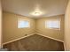 Bright, cozy bedroom featuring neutral carpet and natural light from two windows at 2683 Terratim Ln, Decatur, GA 30034