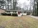 Single story home with brick facade, well maintained lawn and mature trees at 2683 Terratim Ln, Decatur, GA 30034