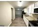 Bright kitchen with stainless steel appliances, granite countertops and modern cabinets at 2683 Terratim Ln, Decatur, GA 30034
