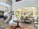 Elegant dining room with hardwood floors, coffered ceilings, and views to a beautifully carpeted staircase at 39 Hannah Way, Palmetto, GA 30268