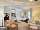 Bright and airy main bedroom boasting a sitting area, tray ceiling, and ample natural light at 39 Hannah Way, Palmetto, GA 30268