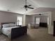 Large main bedroom offering generous space, ceiling fans, neutral paint and plush carpet at 39 Hannah Way, Palmetto, GA 30268