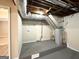 Basement laundry area with hot water heater, shelving, and hook ups at 2296 Aurie Dr, Decatur, GA 30034