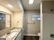 Updated bathroom with a large vanity, framed mirror, and updated fixtures at 2296 Aurie Dr, Decatur, GA 30034