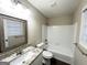 Bright bathroom with a granite countertop vanity and shower-tub combination at 2296 Aurie Dr, Decatur, GA 30034