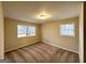 Carpeted bedroom with neutral walls and natural light from two windows at 2296 Aurie Dr, Decatur, GA 30034