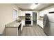 Modern kitchen with stainless steel appliances, granite countertops, and ample cabinet space at 2296 Aurie Dr, Decatur, GA 30034