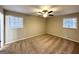 Neutral primary bedroom with two sunny windows, carpeted flooring, and ample space at 2296 Aurie Dr, Decatur, GA 30034