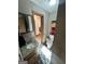 Bathroom with granite vanity, tiled floors, and a framed mirror at 160 Appalachee Church Rd, Auburn, GA 30011