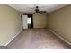 Bedroom featuring a ceiling fan, light tan walls and tan carpeting at 160 Appalachee Church Rd, Auburn, GA 30011
