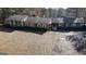 Aerial view of a brick home showing the home's traditional exterior with a long driveway at 160 Appalachee Church Rd, Auburn, GA 30011