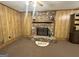 Living room showcasing a stone fireplace with a wood mantel and carpet flooring at 160 Appalachee Church Rd, Auburn, GA 30011