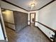 Hallway featuring tile flooring, brick accent wall, and traditional trim at 160 Appalachee Church Rd, Auburn, GA 30011