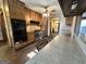 Modern kitchen with wooden cabinetry, stainless steel appliances, stone countertops and wood-look floors at 160 Appalachee Church Rd, Auburn, GA 30011