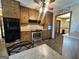 A well-equipped kitchen featuring stainless steel appliances, tile backsplash, and wooden cabinetry at 160 Appalachee Church Rd, Auburn, GA 30011