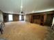 Large living room boasting neutral walls, carpet, wooden cabinets and a ceiling fan at 160 Appalachee Church Rd, Auburn, GA 30011