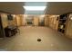 Spacious living room with a stone fireplace, wood paneling, and a large window at 160 Appalachee Church Rd, Auburn, GA 30011