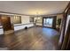 Spacious living room featuring hardwood floors, large window, and a classic chandelier at 160 Appalachee Church Rd, Auburn, GA 30011