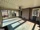 Sun Room featuring brick accent wall, fan, and multiple windows at 160 Appalachee Church Rd, Auburn, GA 30011