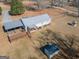 Home with a large deck, adjacent to a smaller shed, situated on a sprawling lot at 382 Lamb Rd, Moreland, GA 30259