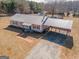 Aerial view of a well-maintained home with a carport and landscaping at 382 Lamb Rd, Moreland, GA 30259