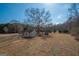 Backyard featuring open yard and outbuilding at 382 Lamb Rd, Moreland, GA 30259