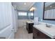 Bathroom with double vanity, tile floor, and walk-in shower at 382 Lamb Rd, Moreland, GA 30259