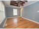 Bright bedroom with hardwood floors, natural light, and a stylish ceiling fan at 382 Lamb Rd, Moreland, GA 30259