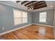 Bedroom featuring hardwood floors, two windows and a ceiling fan at 382 Lamb Rd, Moreland, GA 30259