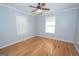 Bedroom featuring hardwood floors and a ceiling fan at 382 Lamb Rd, Moreland, GA 30259