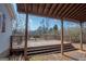 View of covered carport with wooden deck, adjacent to the main house at 382 Lamb Rd, Moreland, GA 30259