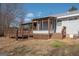 Back of house featuring a wooden deck and neutral siding at 382 Lamb Rd, Moreland, GA 30259