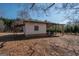 Outbuilding with covered porch and white siding in a leafy yard at 382 Lamb Rd, Moreland, GA 30259