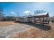 Exterior view of home featuring covered carport and convenient parking at 382 Lamb Rd, Moreland, GA 30259