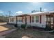 Charming one-story home featuring a welcoming front porch and convenient covered parking at 382 Lamb Rd, Moreland, GA 30259