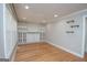Bright living room with hardwood floors, built-in shelving, and ample natural light at 382 Lamb Rd, Moreland, GA 30259