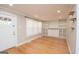 Charming living room featuring hardwood floors, built-in shelving, and a bright entryway at 382 Lamb Rd, Moreland, GA 30259
