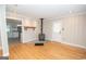 Cozy living room featuring a wood-burning stove, hardwood floors, and natural light at 382 Lamb Rd, Moreland, GA 30259