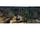 An aerial view of a quaint home surrounded by lush greenery and trees, creating a serene and private setting at 116 Appalachee Church Rd, Auburn, GA 30011