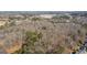 Expansive aerial view of a heavily wooded lot showcasing its natural setting and potential at 116 Appalachee Church Rd, Auburn, GA 30011