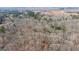 Expansive aerial view of a heavily wooded lot showcasing its natural setting and potential at 116 Appalachee Church Rd, Auburn, GA 30011