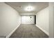 Finished basement area with carpeting and white trim, featuring three entry/exit points at 2343 Deer Pass Way, Decatur, GA 30035
