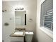 The bathroom features a vanity with granite counters, a white toilet, and a shower with white tiling at 2343 Deer Pass Way, Decatur, GA 30035